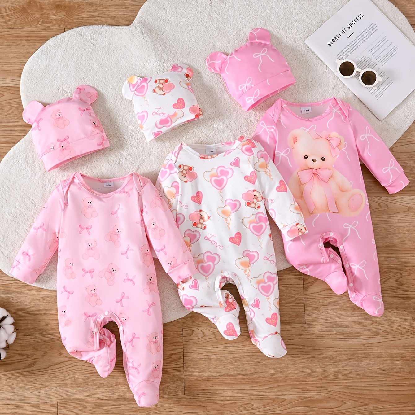 Set of 6 Long-Sleeve Footed Rompers for Newborn Girls, Adorned with Bear And Bow Designs, Complete with a Button Closure at The Bottom And a Matching Bunny Hat. This Soft And Cozy Outfit Makes a Perfect Gift And Is a Must-Have for Every Baby