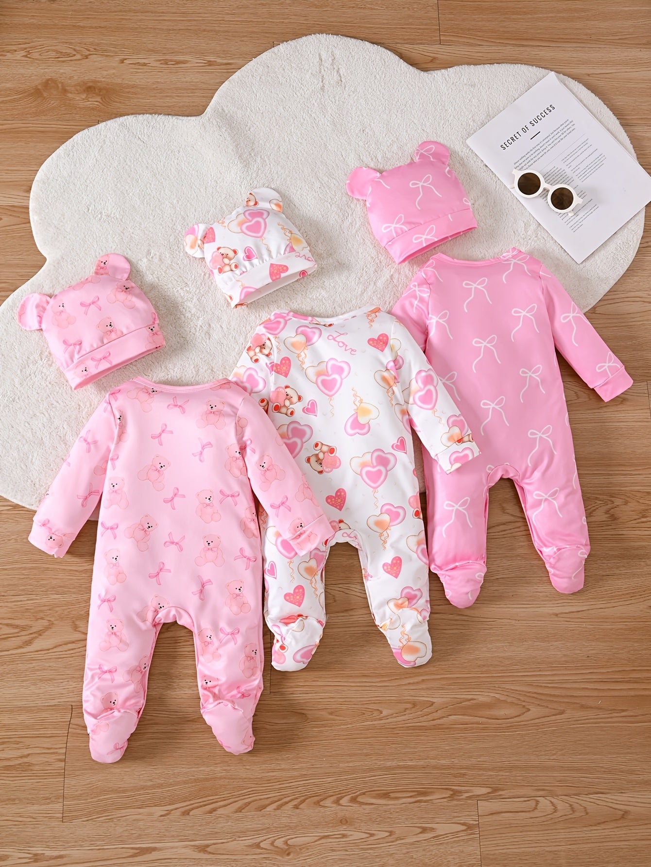 Set of 6 Long-Sleeve Footed Rompers for Newborn Girls, Adorned with Bear And Bow Designs, Complete with a Button Closure at The Bottom And a Matching Bunny Hat. This Soft And Cozy Outfit Makes a Perfect Gift And Is a Must-Have for Every Baby