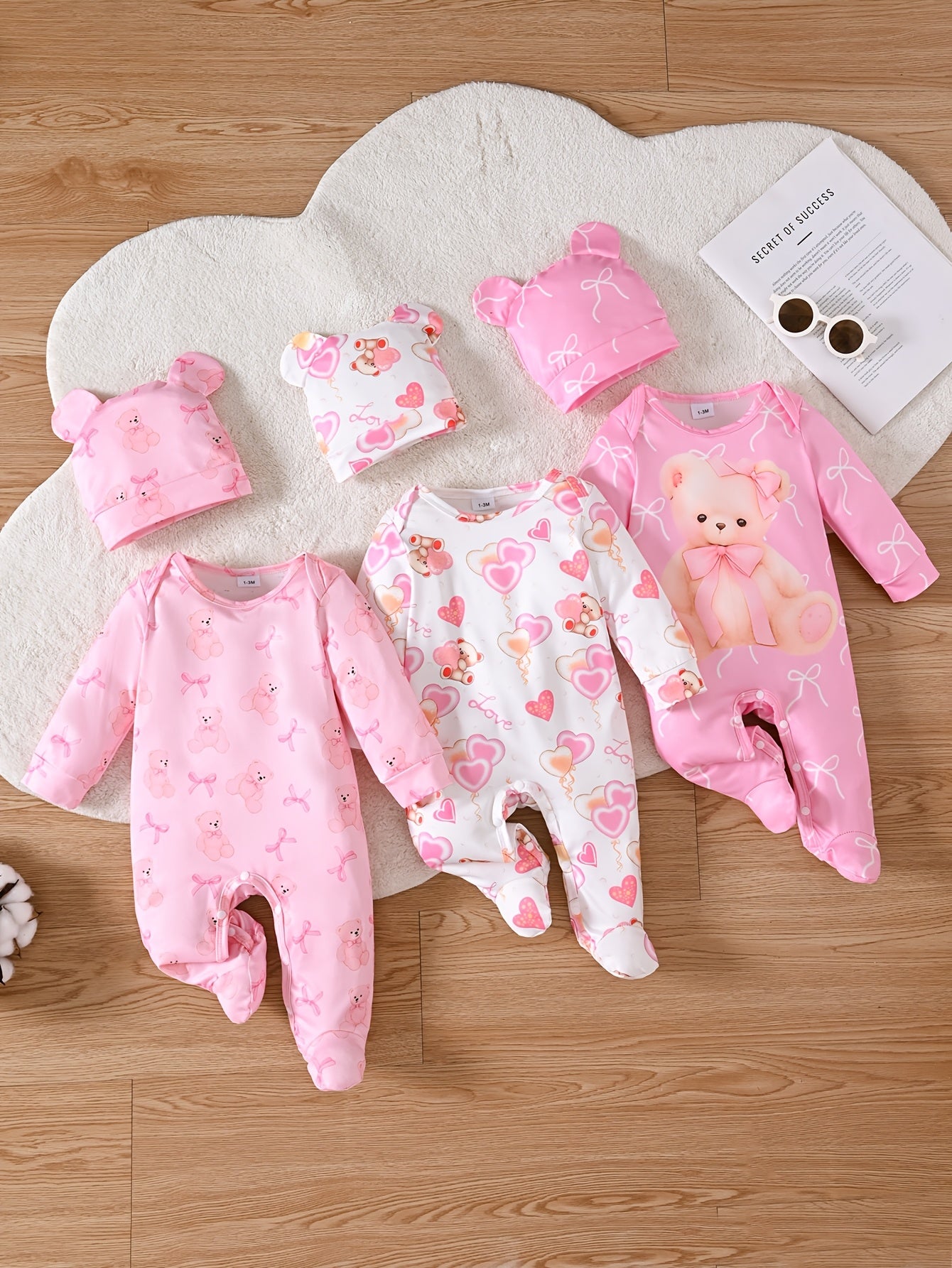 Set of 6 Long-Sleeve Footed Rompers for Newborn Girls, Adorned with Bear And Bow Designs, Complete with a Button Closure at The Bottom And a Matching Bunny Hat. This Soft And Cozy Outfit Makes a Perfect Gift And Is a Must-Have for Every Baby