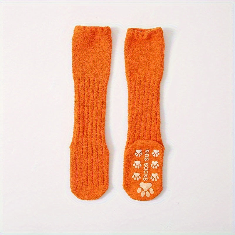 A Pair of Thick, Plush Coral Fleece Knee-High Socks for Infants And Toddlers, Designed to Be Non-Slip for Indoor Use And Prevent Shedding